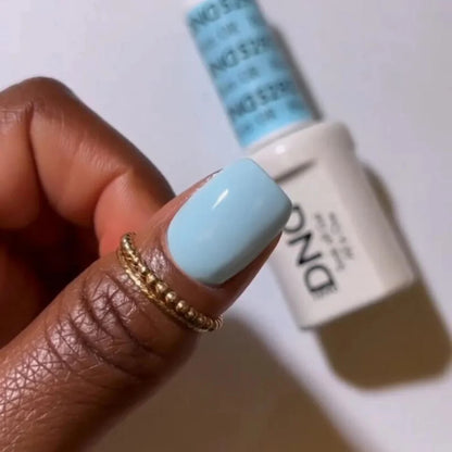 Close-up manicure showing DND Blue River #529 minty blue gel nail polish with a smooth finish.