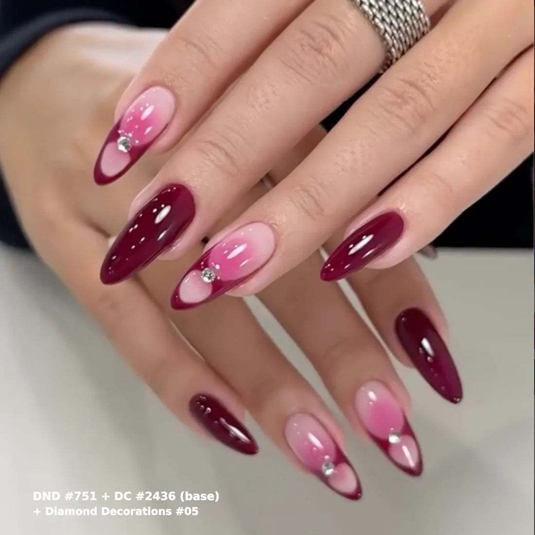 Finished manicure look with DND Cherry Mocha #751 gel polish, a deep cherry brown with red purple tones for a black cherry effect