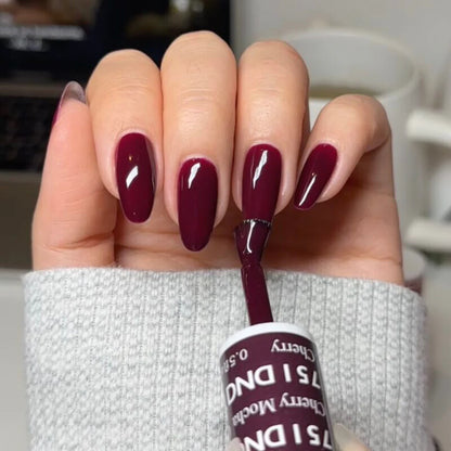 Full manicure showing DND Cherry Mocha 751 deep cherry brown gel polish applied on natural nails.