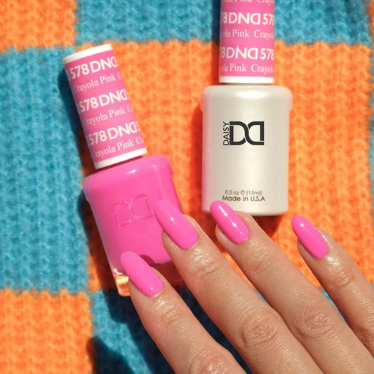 Hand wearing DND Crayola Pink #578 gel polish, showing the bright hot pink tone on the nails