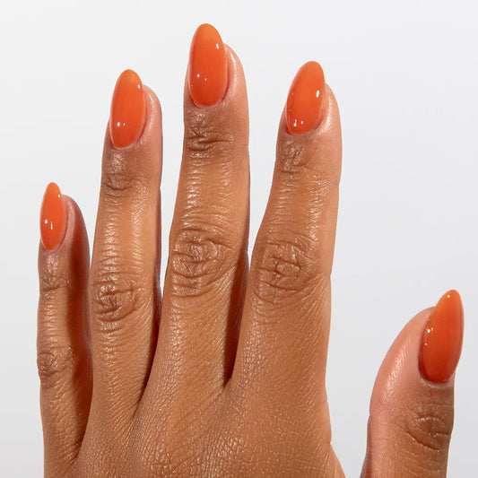 DND DC jelly gel polish on a manicured hand for Terracotta 035 showing the sun baked camel glow in natural light