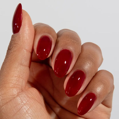 DND DC jelly gel polish on a manicured hand for Sangria 030 showing the bold sultry finish in natural light