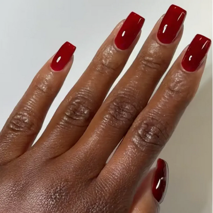 DND DC jelly gel polish on a dark skin tone hand for Sangria 030 in a deep red berry finish