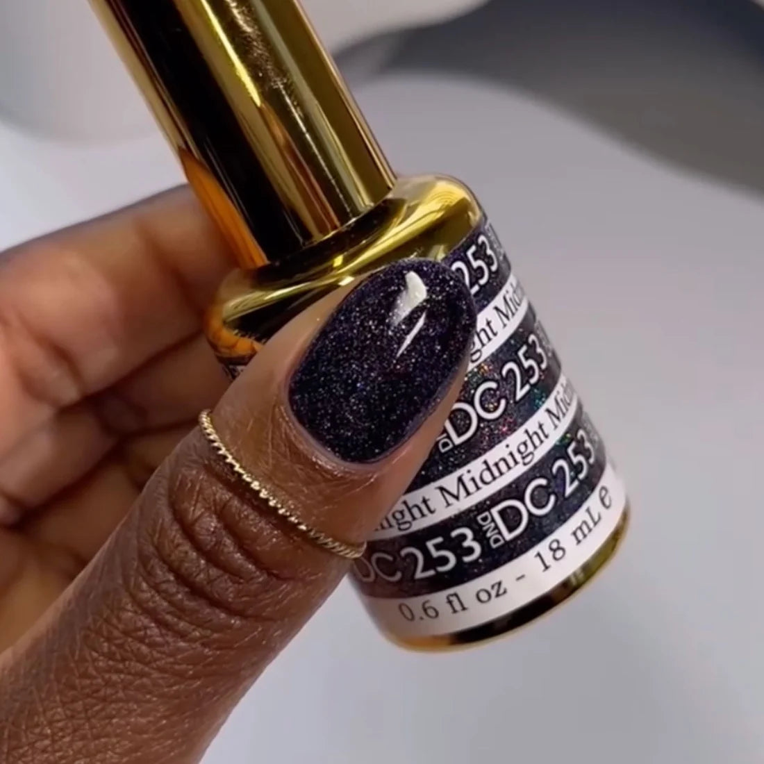 Dark navy black holographic nails created with DND DC Midnight #253 gel nail polish