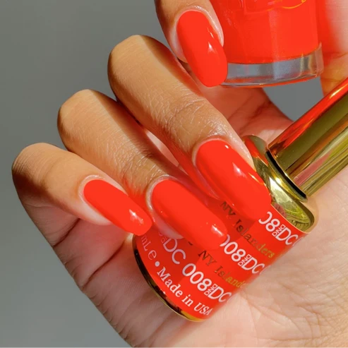 Manicured nails painted in DND DC NY Islanders #008 vivid hot neon orange gel polish