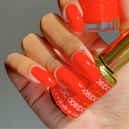 Manicured nails painted in DND DC NY Islanders #008 vivid hot neon orange gel polish