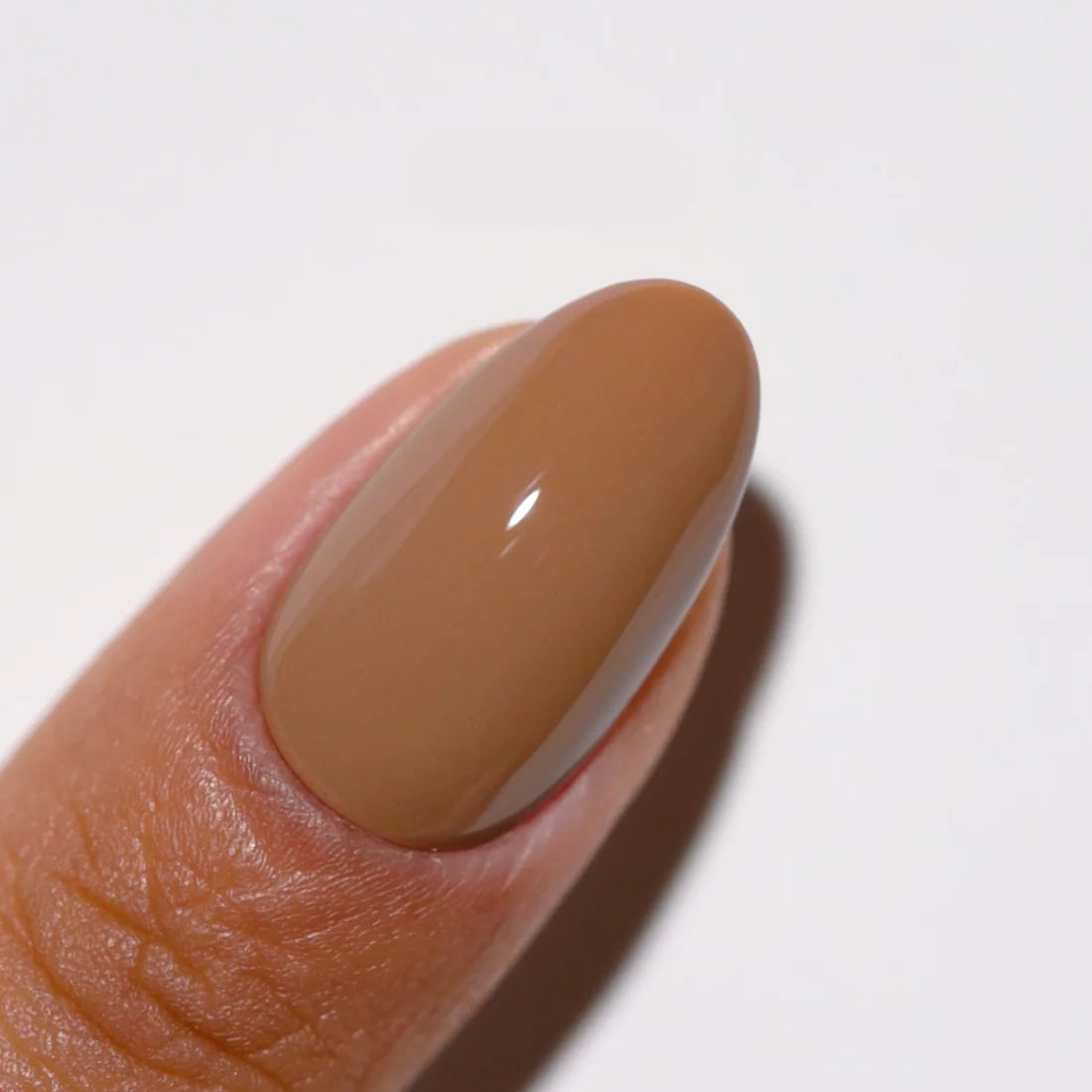Creamy brown nude gel polish swatch on nails, DND DC S’Mores #316