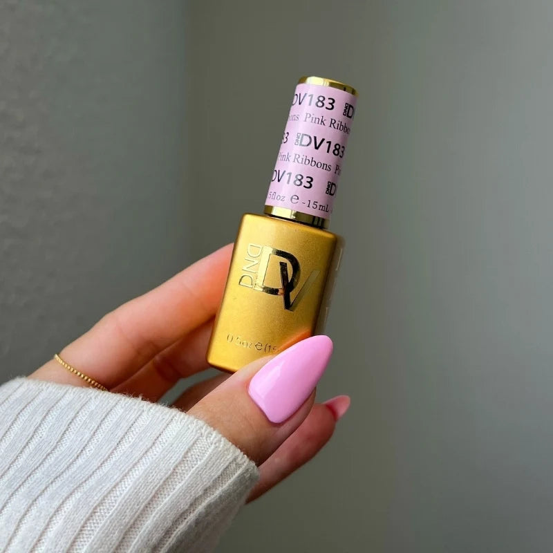 Bright neutral pink gel manicure painted with DND DIVA Pink Ribbons on natural nails
