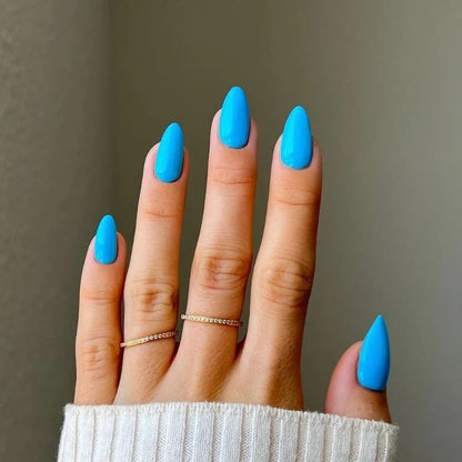 dark baby blue gel manicure painted with DND DIVA Angel Numbers on natural nails