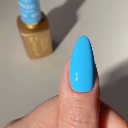 Deep sky blue gel manicure painted with DND DIVA Angel Numbers on natural finger nails