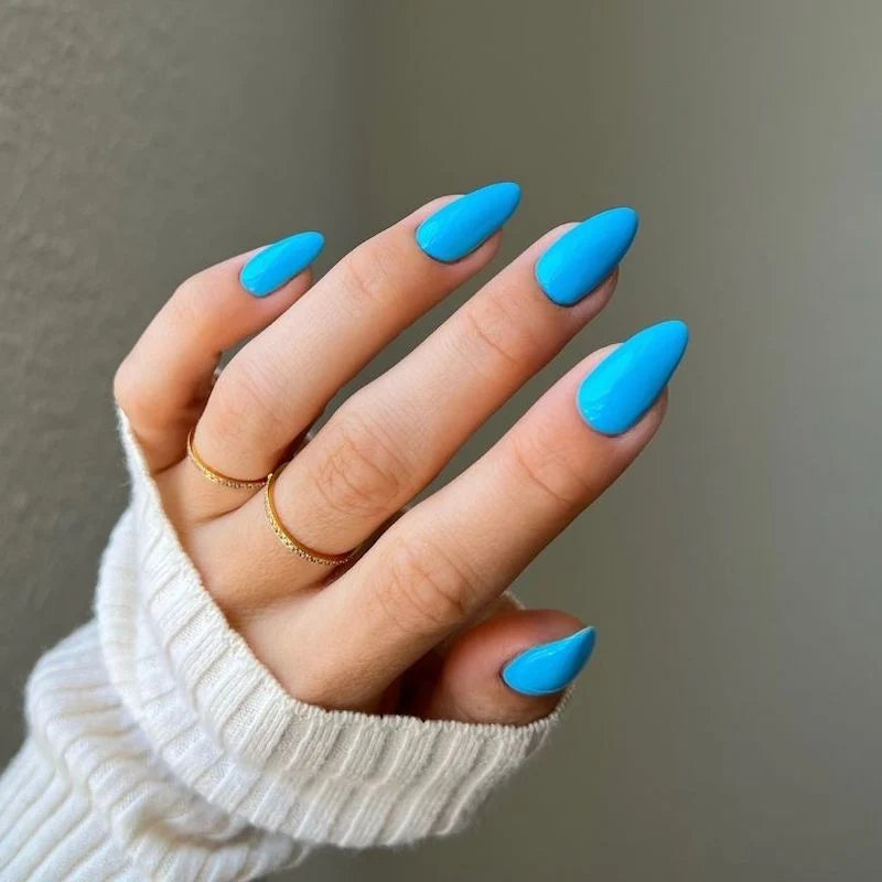 Deep sky blue gel manicure painted with DND DIVA Angel Numbers on natural nails