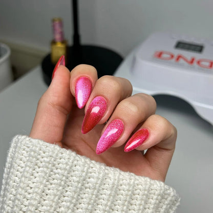 Cat eye nails done in DND Diva Cat Eye Gel Polish #14 Hi Kitty, highlighting the hot pink shimmer effect.