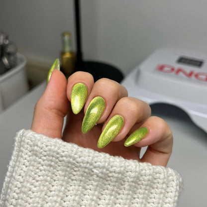 Cat eye nails done in DND Diva Cat Eye Gel Polish #15 Lemon Whiskers, highlighting the lemon lime shimmer effect.