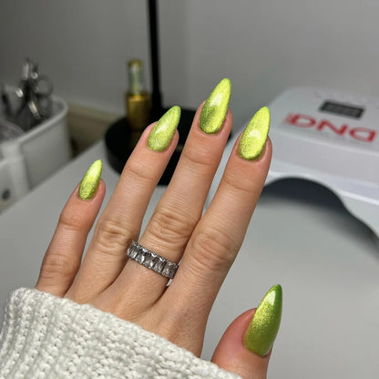 Full manicure in DND Diva Cat Eye Gel Polish #15 Lemon Whiskers, showing the lemon lime cat eye finish on natural nails.