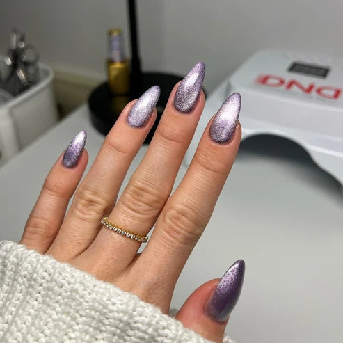 Full manicure in DND Diva Cat Eye Gel Polish #19 Wild Berry, showing the muted grape cat eye finish on natural nails.