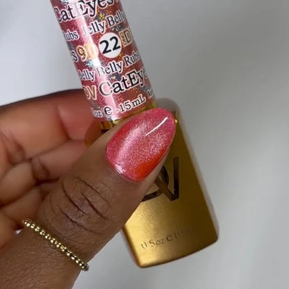 Close up manicure photo in DND Diva Cat Eye Gel Polish #22 Jelly Belly Rubs, showing the depth of the watermelon pink cat eye effect.