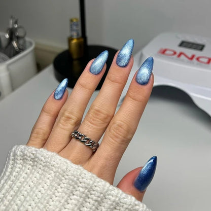 Full manicure in DND Diva Cat Eye Gel Polish #23 Catnip Craze, showing the velvety blue cat eye finish on natural nails.