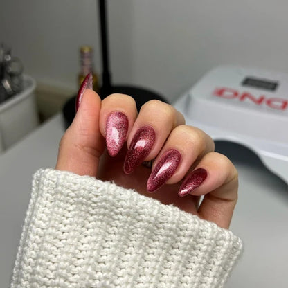Cat eye nails done in DND Diva Cat Eye Gel Polish #24 Hot Cinnamon, highlighting the cinnamon pink shimmer effect.