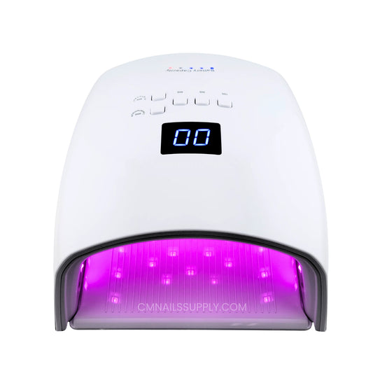 DND gel UV LED nail lamp on a nail table
