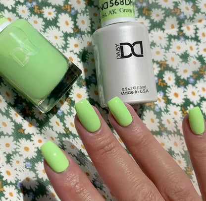 Finger nail painted with DND Green Forest #568, a shockingly bright neon green gel polish