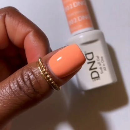 DND Honeymoon #802 light beige and orange manicure