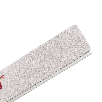 Close up of zebra coated 80 grit nail file texture used for acrylic and hard gel shaping
