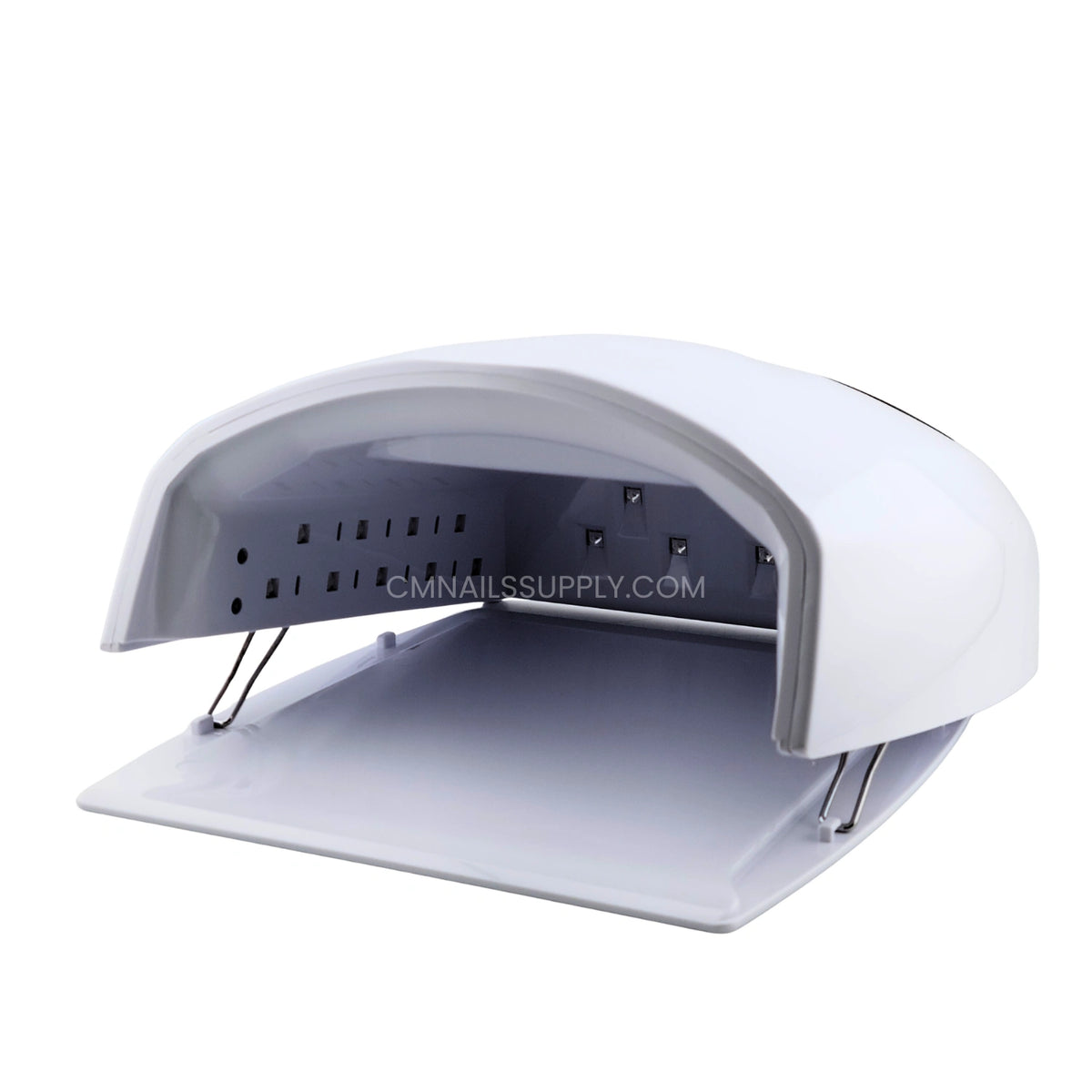 Close up of the empty curing chamber inside the white DND nail lamp