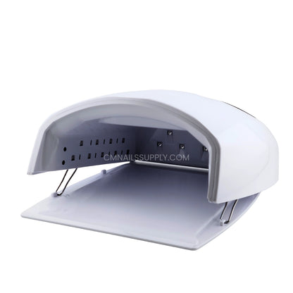 Close up of the empty curing chamber inside the white DND nail lamp
