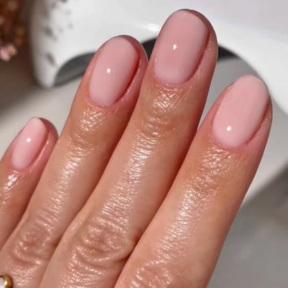 Close up manicure detail of DND Pink Bubble #8686 porcelain pink sheer gel polish finish