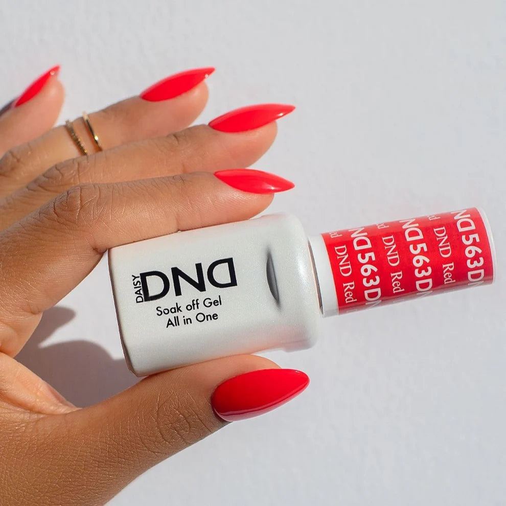 Finger nail painted with DND Red #563, a bold neon red gel polish