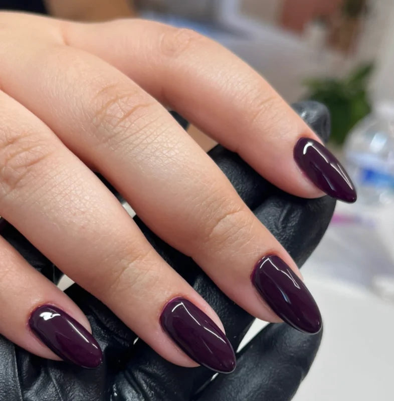 DND Rosewood #428 manicure swatch showing the rich rosewood nail polish shade.