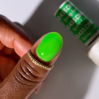 Close-up manicure showing DND Spring Leaf #435 spring green gel nail polish colour on nails.