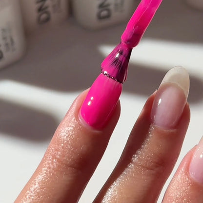 Finger nail painted with DND Teenage Dream #559, a shockingly chic neon pink gel polish