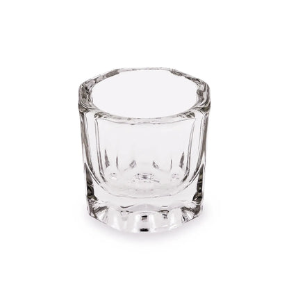 Clear glass dappen dish on a white background