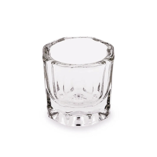 Clear glass dappen dish on a white background