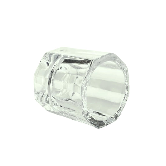 Clear glass dappen dish on a white background