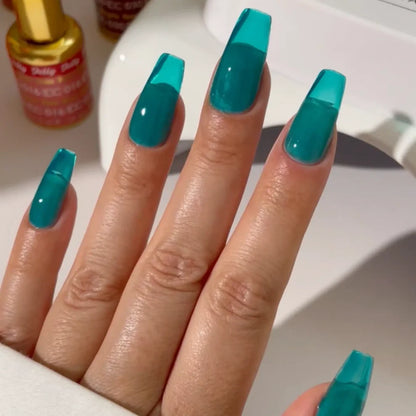 Manicured hand wearing DC Jelly 024 Jade jelly gel polish to show the ocean inspired turquoise finish in natural light