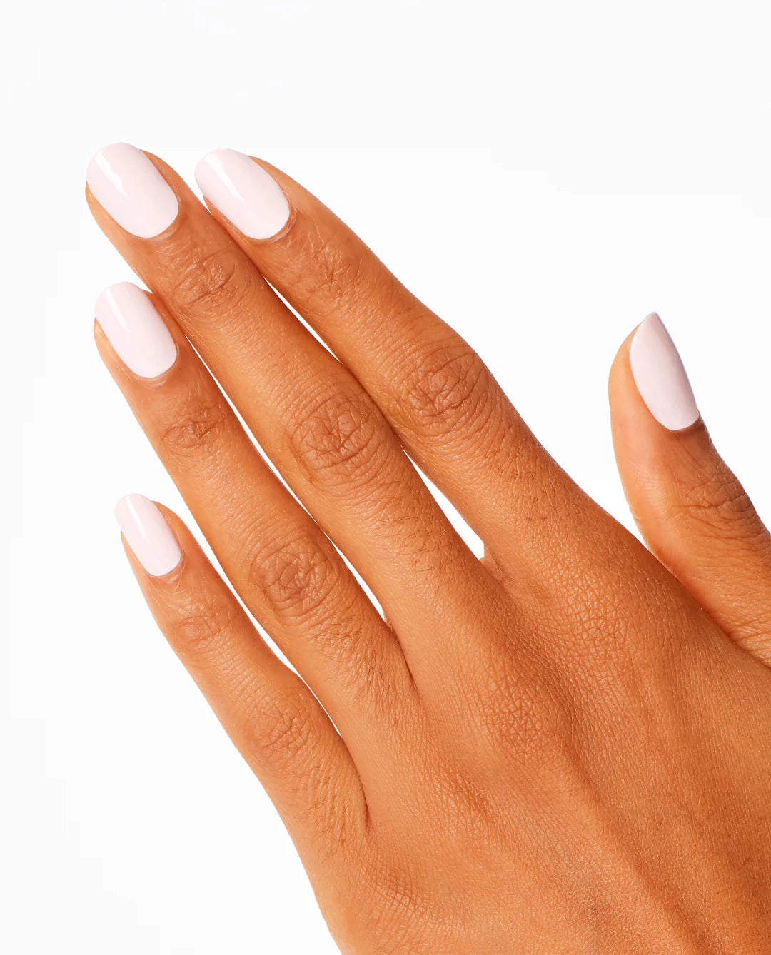 Hand with light pink OPI Nail Lacquer - Lisbon Wants Moor OPI L16 nail polish on a white background