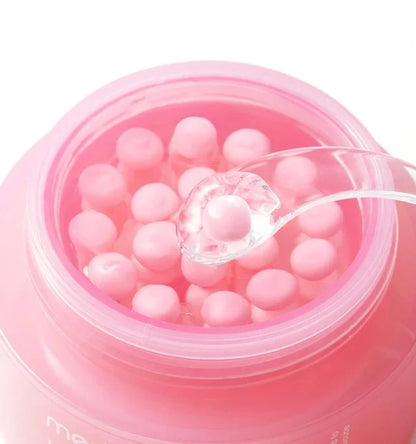 Close up of the pink collagen capsules mixed into the hydrating gel base