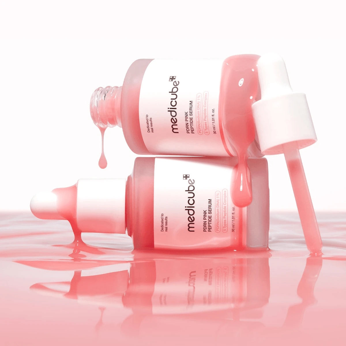 MEDICUBE Collagen PDRN Pink Peptide Serum bottle shown with its dropper top