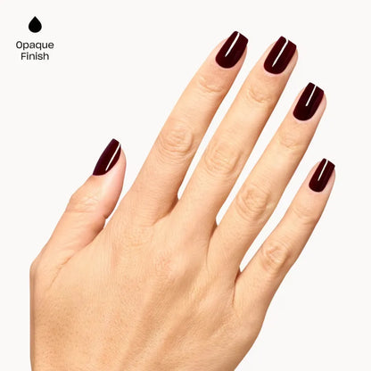 A hand with manicured nails painted in OPI Mrs. O’ Leary’s BBQ a deep opaque burgundy shade, shown against a light gray background with the text 'Opaque Finish' and a black droplet icon in the upper left.