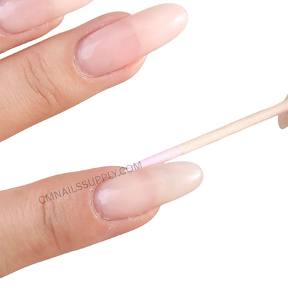 Pink double ended cotton swabs with wooden sticks for manicure cleanup