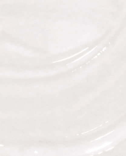 A close-up of a glossy, clear natural nail base coat texture with soft ripples and highlights.