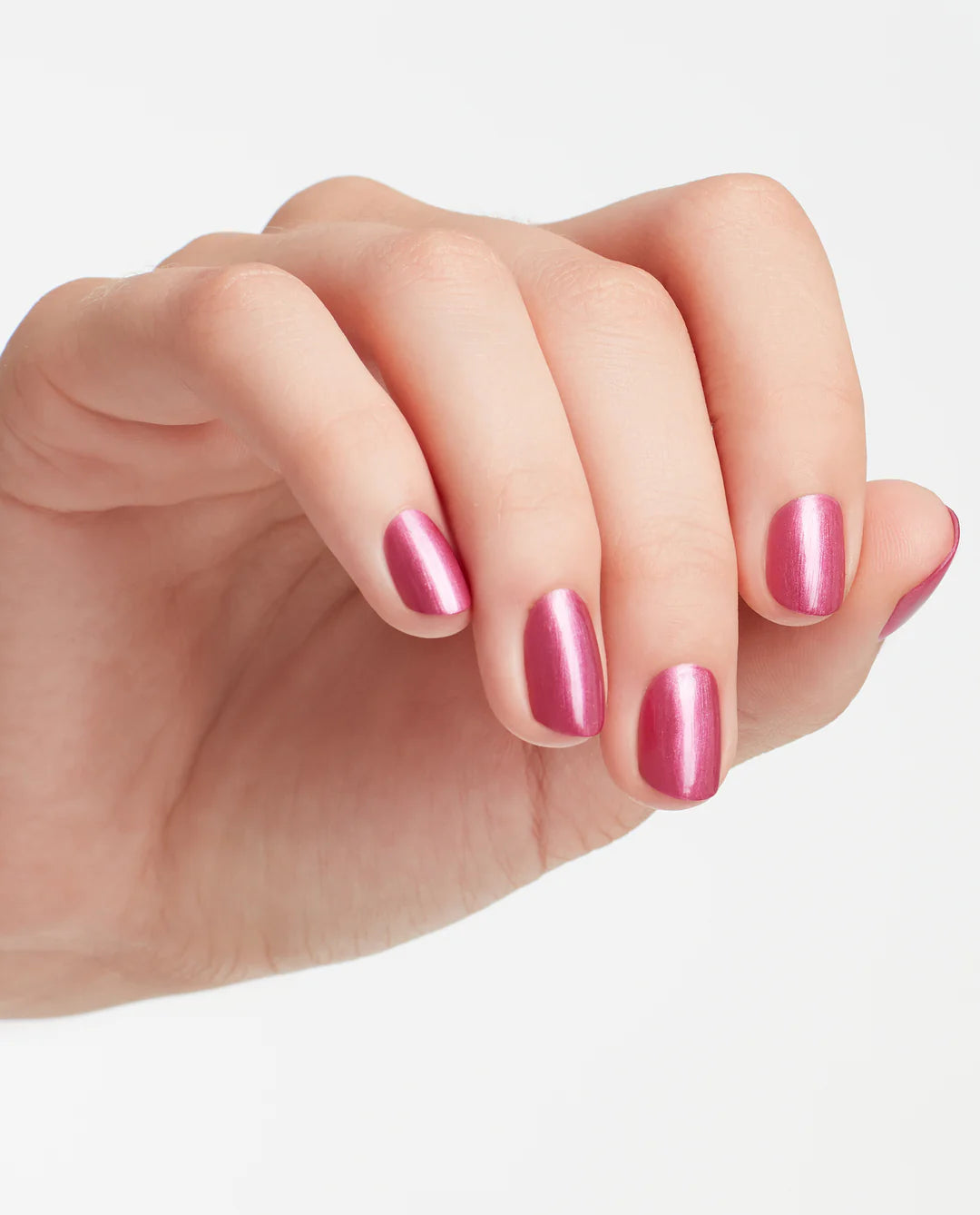 Vibrant manicure on hands displaying OPI A-Rose at Dawn Broke by Noon rose shimmer finish with dimensional sparkle.