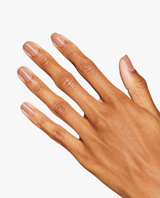 Gel manicure on natural nails showing OPI GelColor Put it in Airplane Mode nude brown crème glossy finish.
