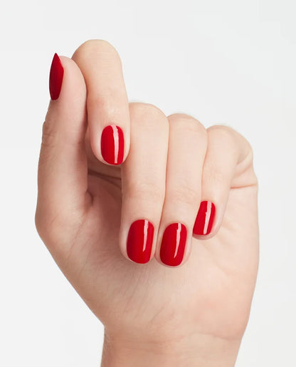Hand with red nail polish on a light gray background OPI GelColor N25 bright red gel polish bottle available at CM Nails Supply, a Canadian nail supply store