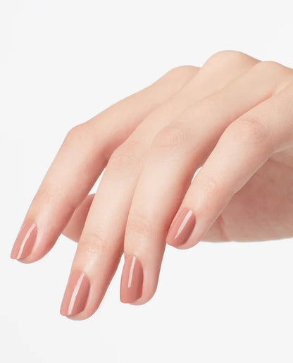 Close up of fingernails painted with OPI GelColor nude gel polish showing a smooth glossy finish