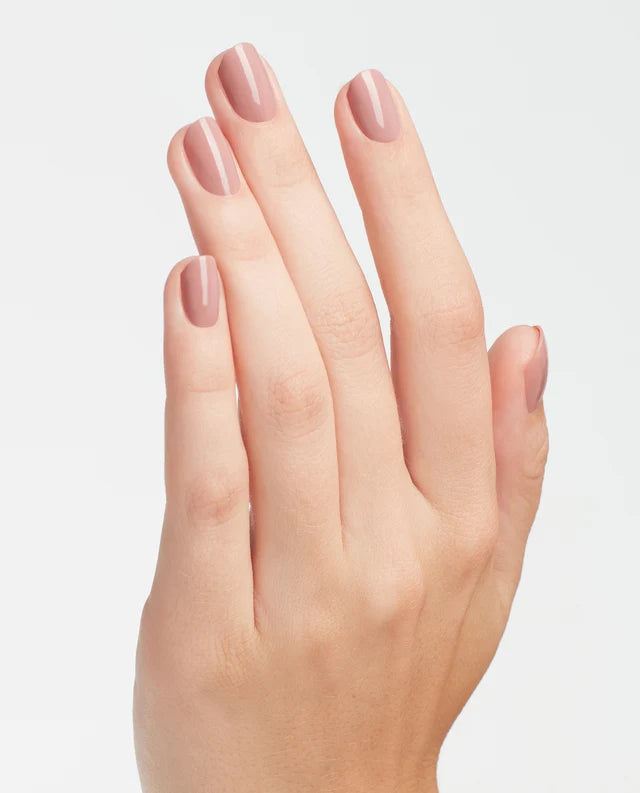 Close up of fingernails painted with OPI GelColor nude pink gel polish showing a glossy finish