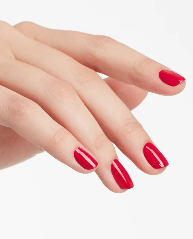 Close up of fingernails painted with OPI GelColor red gel polish showing a bold glossy finish