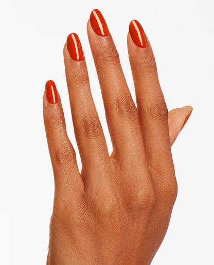 Close up of fingernails painted with OPI GelColor red shimmer gel polish showing a sparkling finish